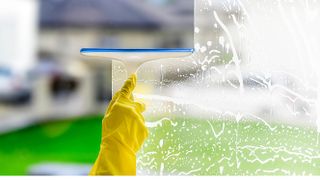 Cleaning window with squeegee