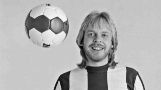 Rick Wakeman tossing a football, March 1983