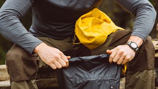 best dry bag: a man holding a dry bag