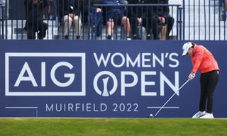 Leona Maguire hits a tee shot in front of an AIG Women's Open board