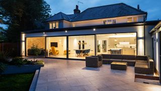 full width single storey flat roof extension with sliding doors