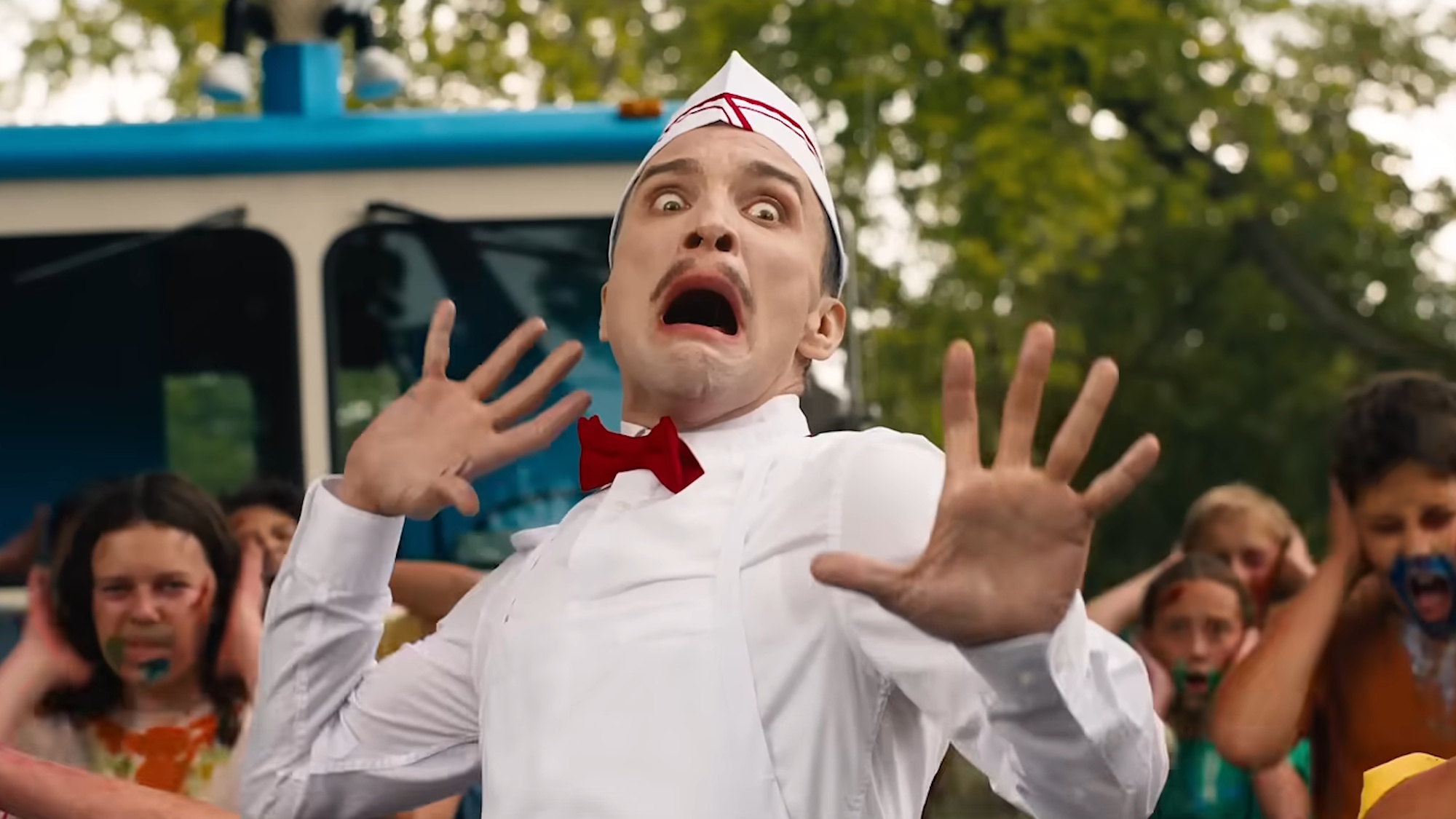 Ari Millen is shown as the titular character of Ice Cream Man, screaming with his hands thrown back.