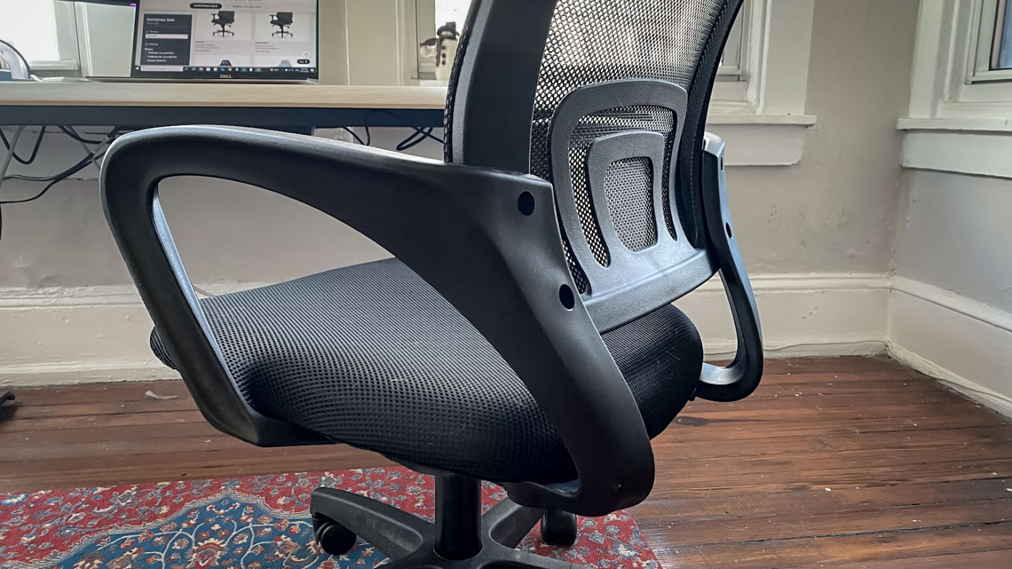 The fixed armrests on an office chair