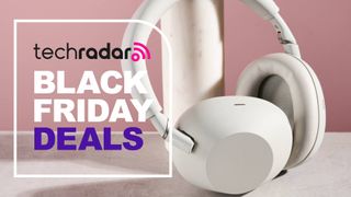 Sony WH-1000XM6 headphones against pink background with the words 'TechRadar: Black Friday deals' positioned on the left side