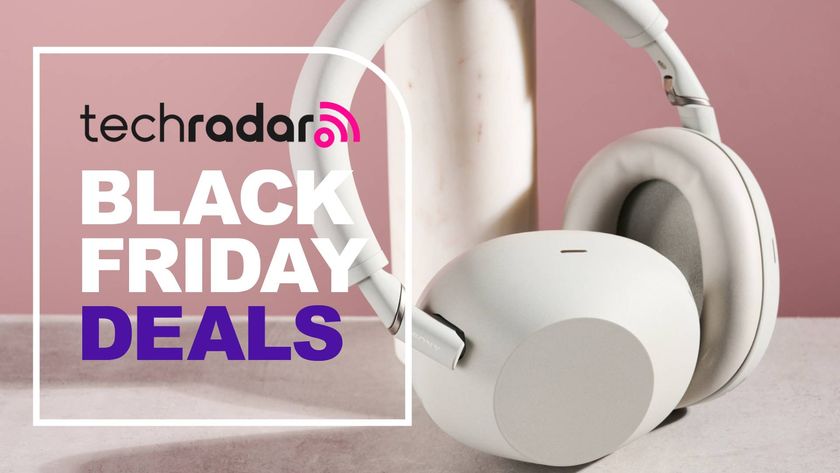 Sony WH-1000XM6 headphones against pink background with the words &#039;TechRadar: Black Friday deals&#039; positioned on the left side