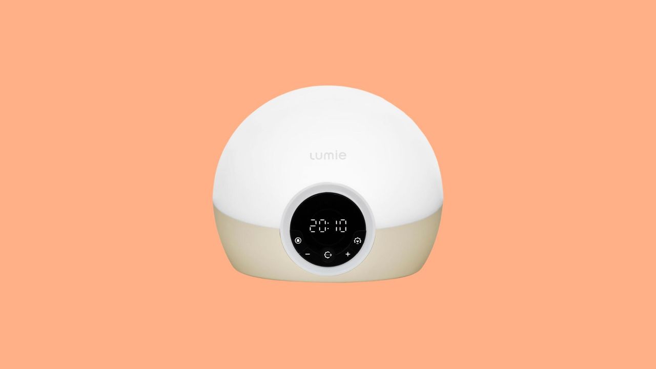 A Lumie alarm clock on an orange background