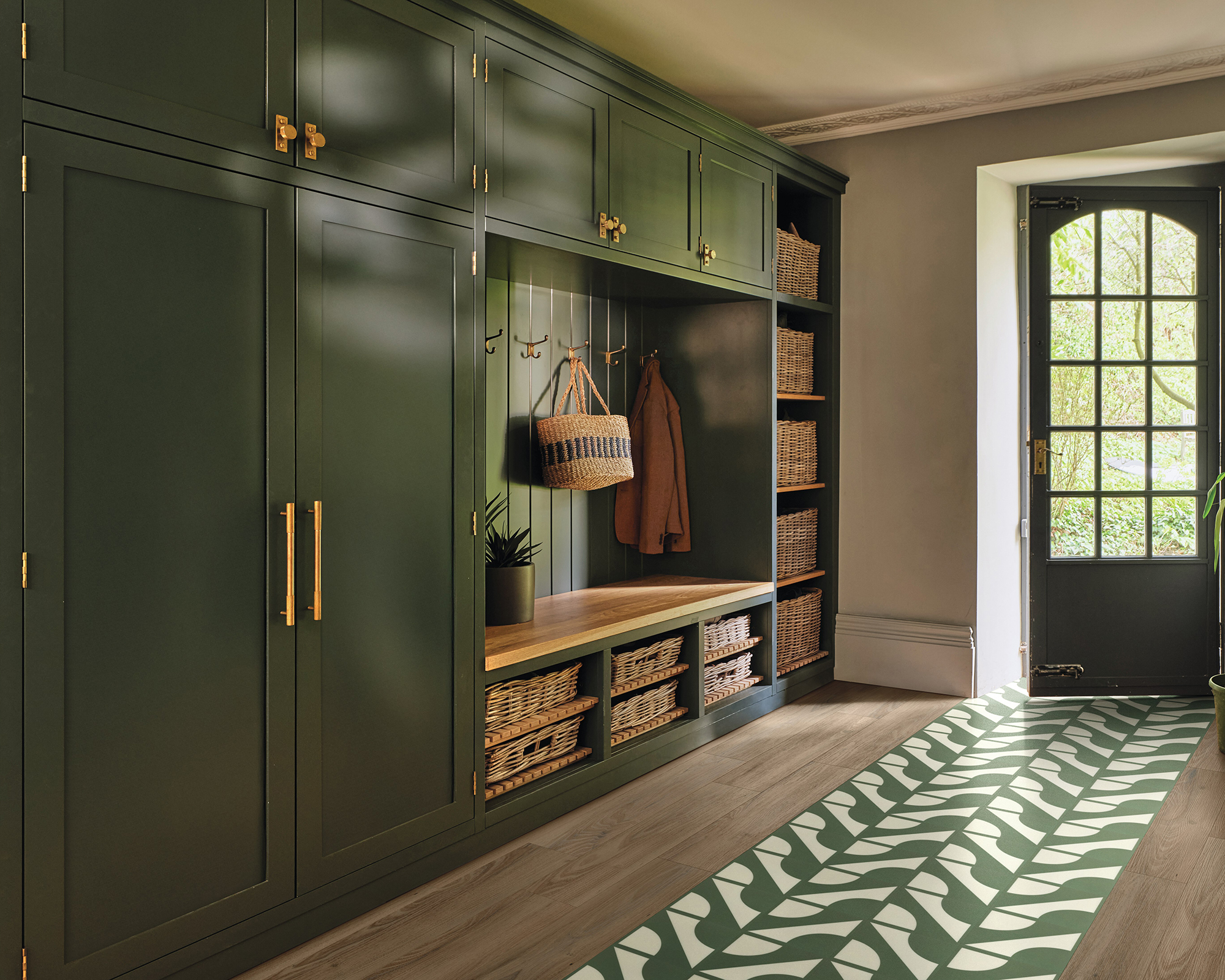 entryway with green tiles on the floor