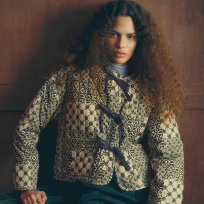 a model wearing a quilted jacket from sezane x antoinette poisson