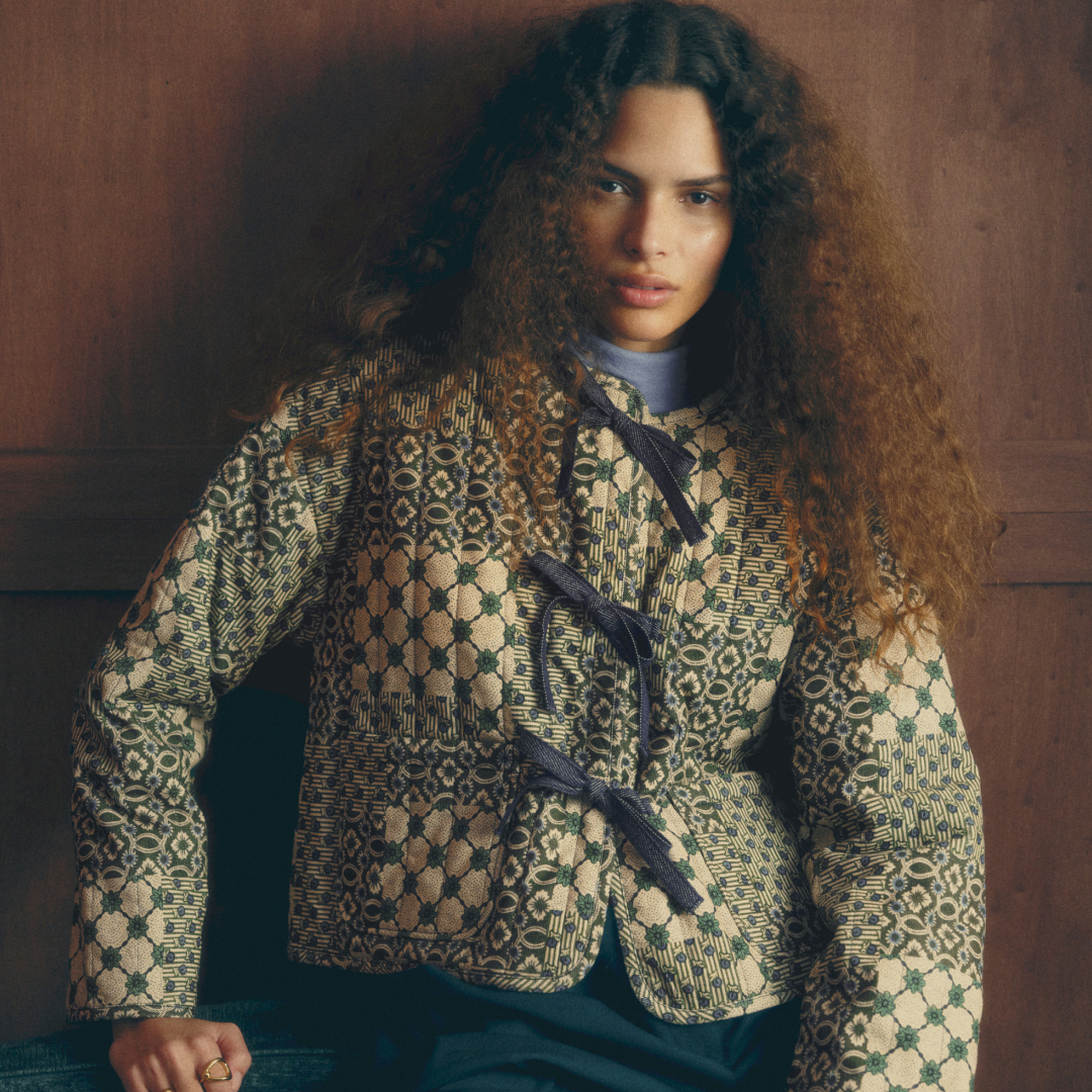 a model wearing a quilted jacket from sezane x antoinette poisson