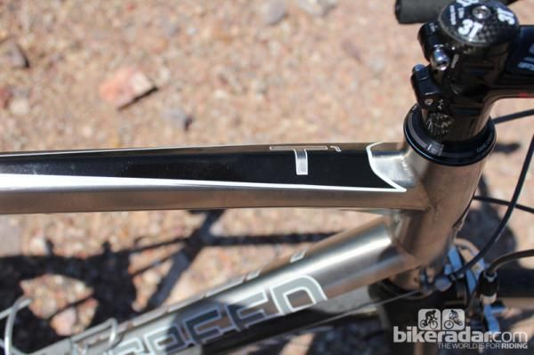 The new T1 uses a highly expensive titanium alloy with a highly expensive shaping process on the top tube