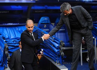 Pep Guardiola and Jose Mourinho shake hands ahead of a Champions League clash between Real Madrid and Barcelona at the Santiago Bernabeu in April 2011.