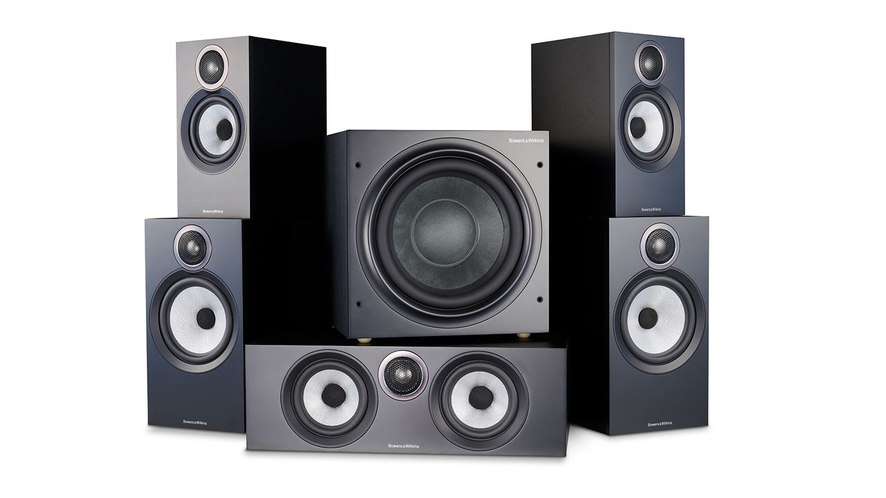 The Bowers &amp; Wilkins 606 &amp; 607 S3 surround speaker package. It includes five rectangular speakers surrounding a square subwoofer. All of them are black and the background is white.