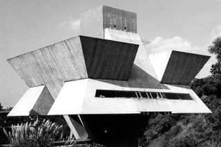 black and white concrete building with raw geometric forms
