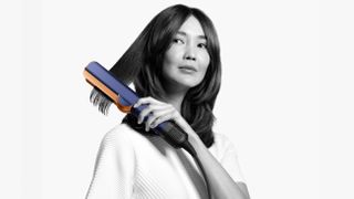 Woman holding Dyson Airstrait