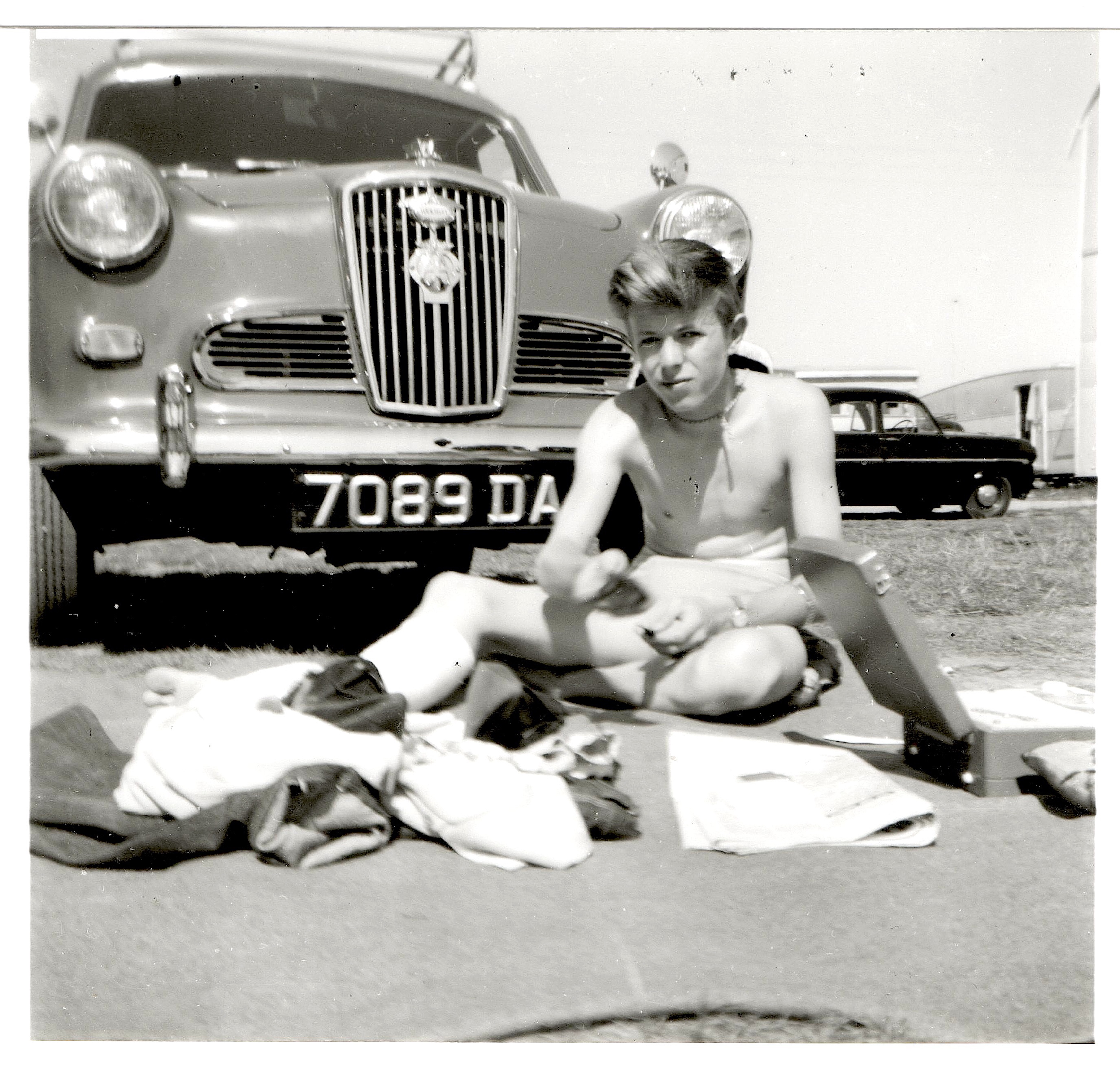 Teenage David Bowie and car