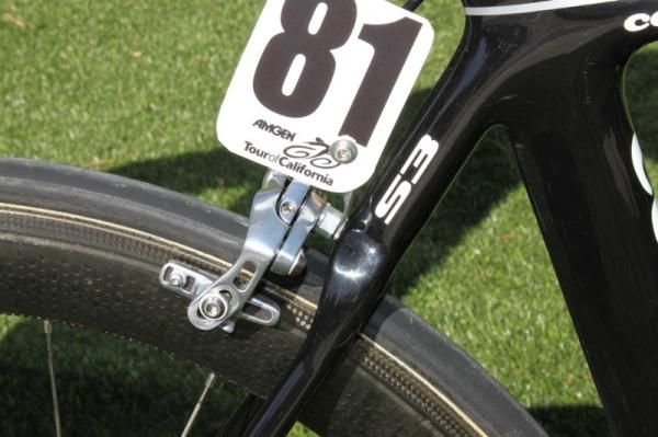 Almost all of the teams fabricate a similar number holder that is fixed with the brake bolt.