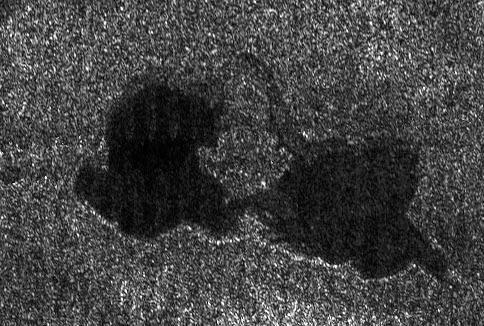 An image from NASA&#039;s Cassini probe, taken Sept. 23, 2006, shows a pair of hydrocarbon lakes on Titan.