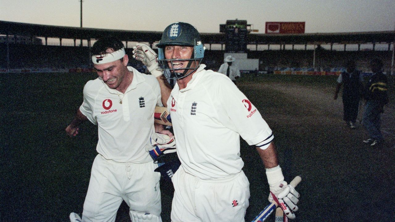 Nasser Hussain and Graham Thorpe celebrate a series win in the dark in Pakistan