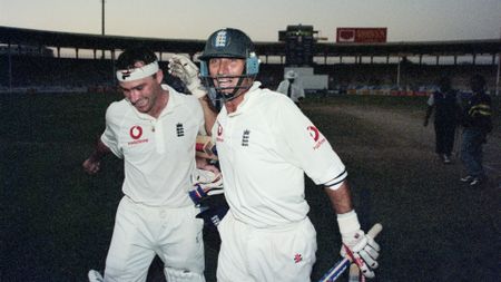 Nasser Hussain and Graham Thorpe celebrate a series win in the dark in Pakistan