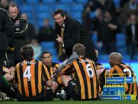 Hull City manager Phil Brown delivers his half-time team talk on the pitch during the Premier League match against Manchester City at the Etihad Stadium, December 2008