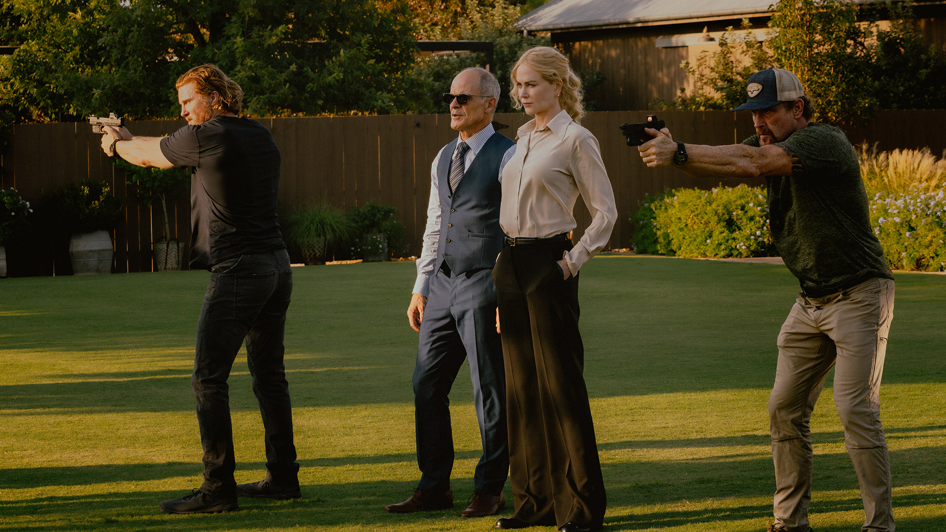 Kaitlyn and Byron stand with men with guns in Lioness season 2