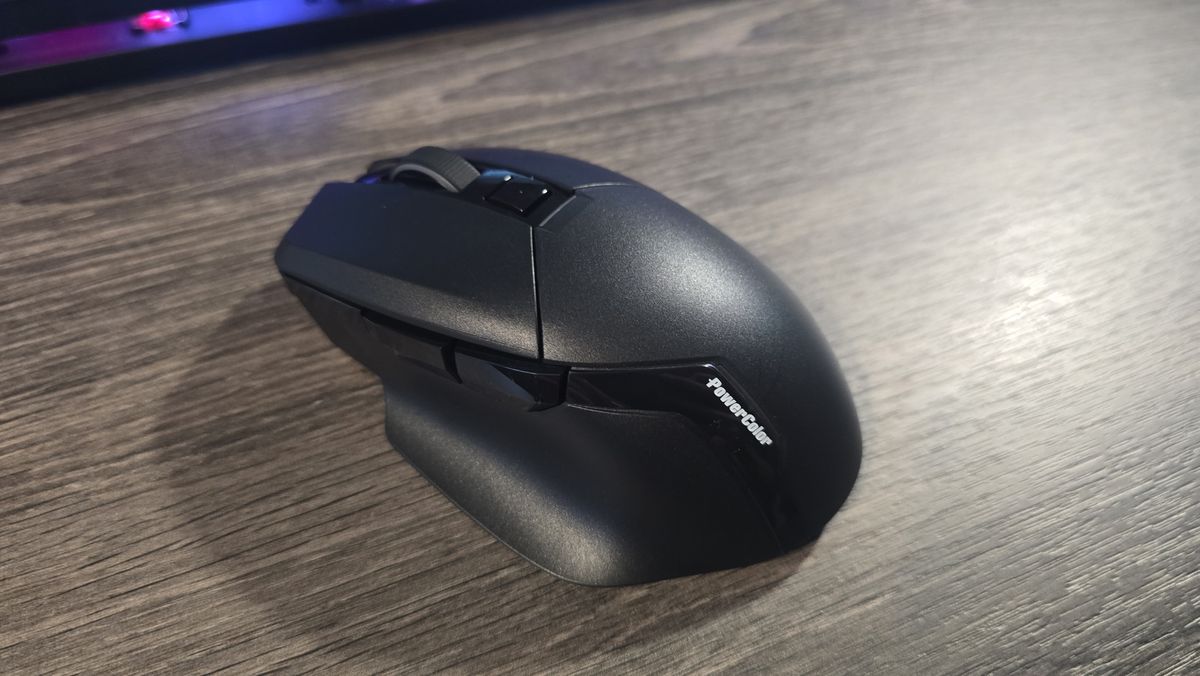 Powercolor Alphyn AM10 Wireless Gaming Mouse with RGB enabled on a desk.