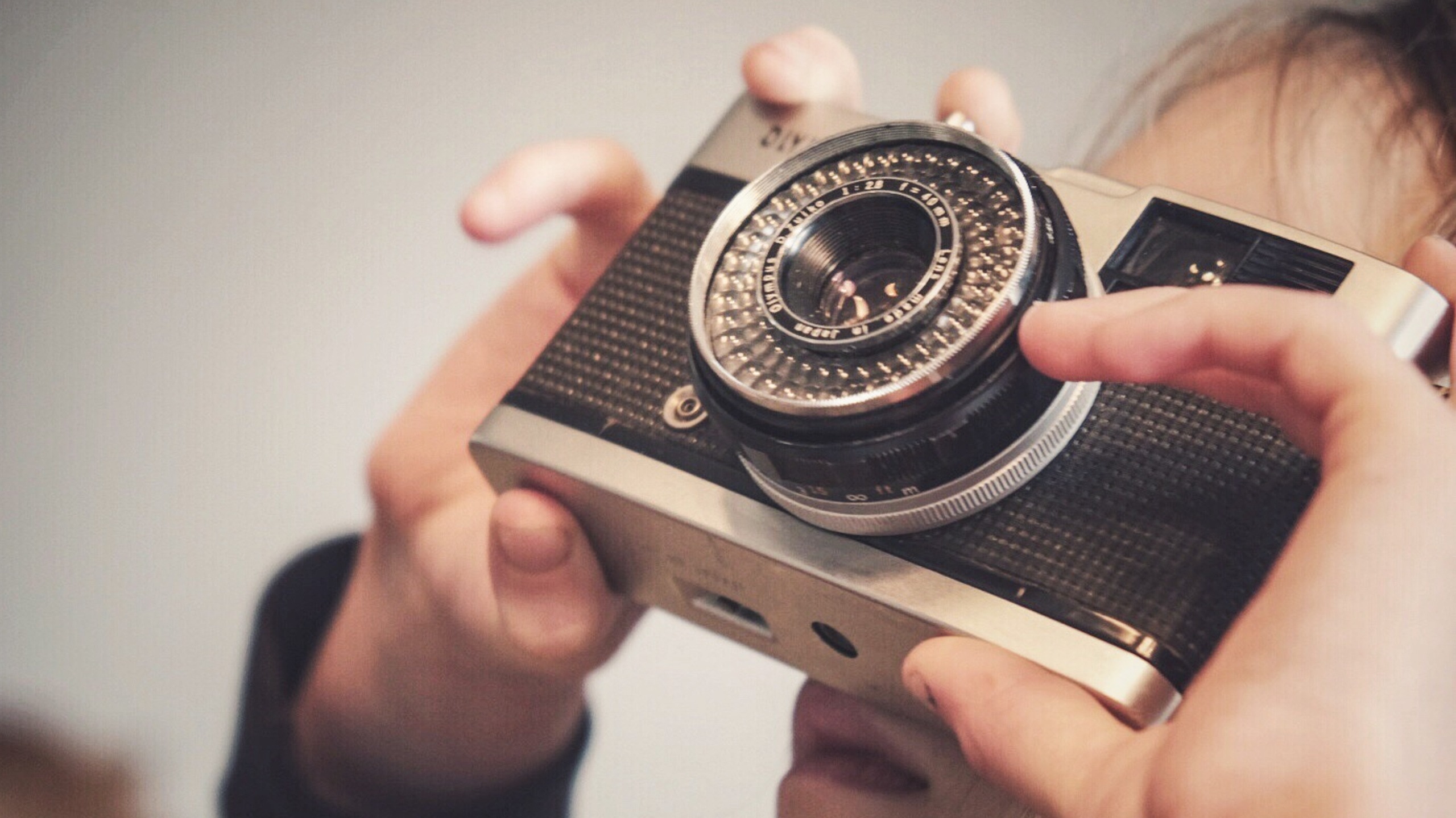 Olympus Trip 35 camera held in child's hands