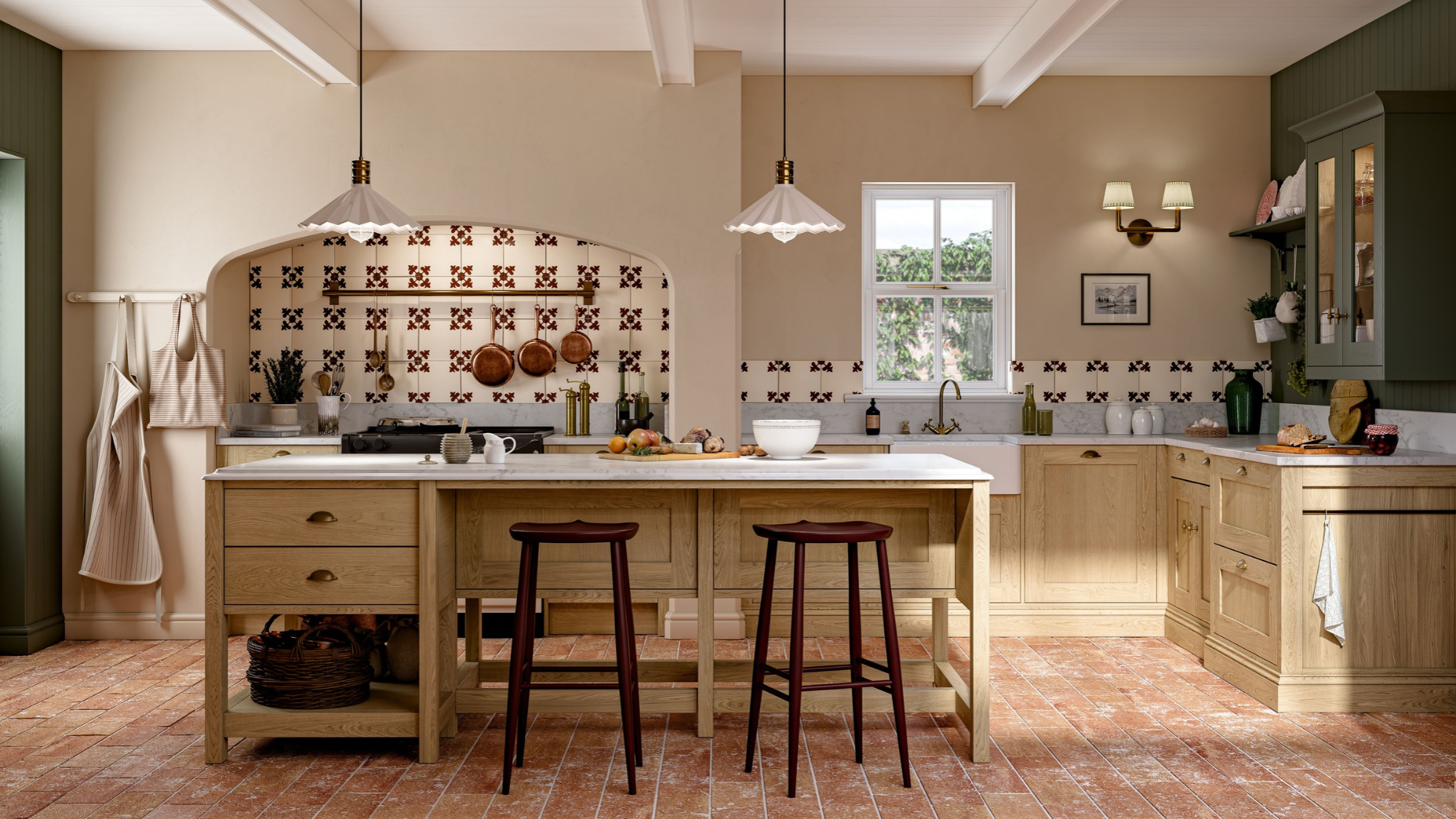 Oak shaker kitchen with marble-topped island, two dark stools, copper pans in tiled alcove and terracotta brick floor