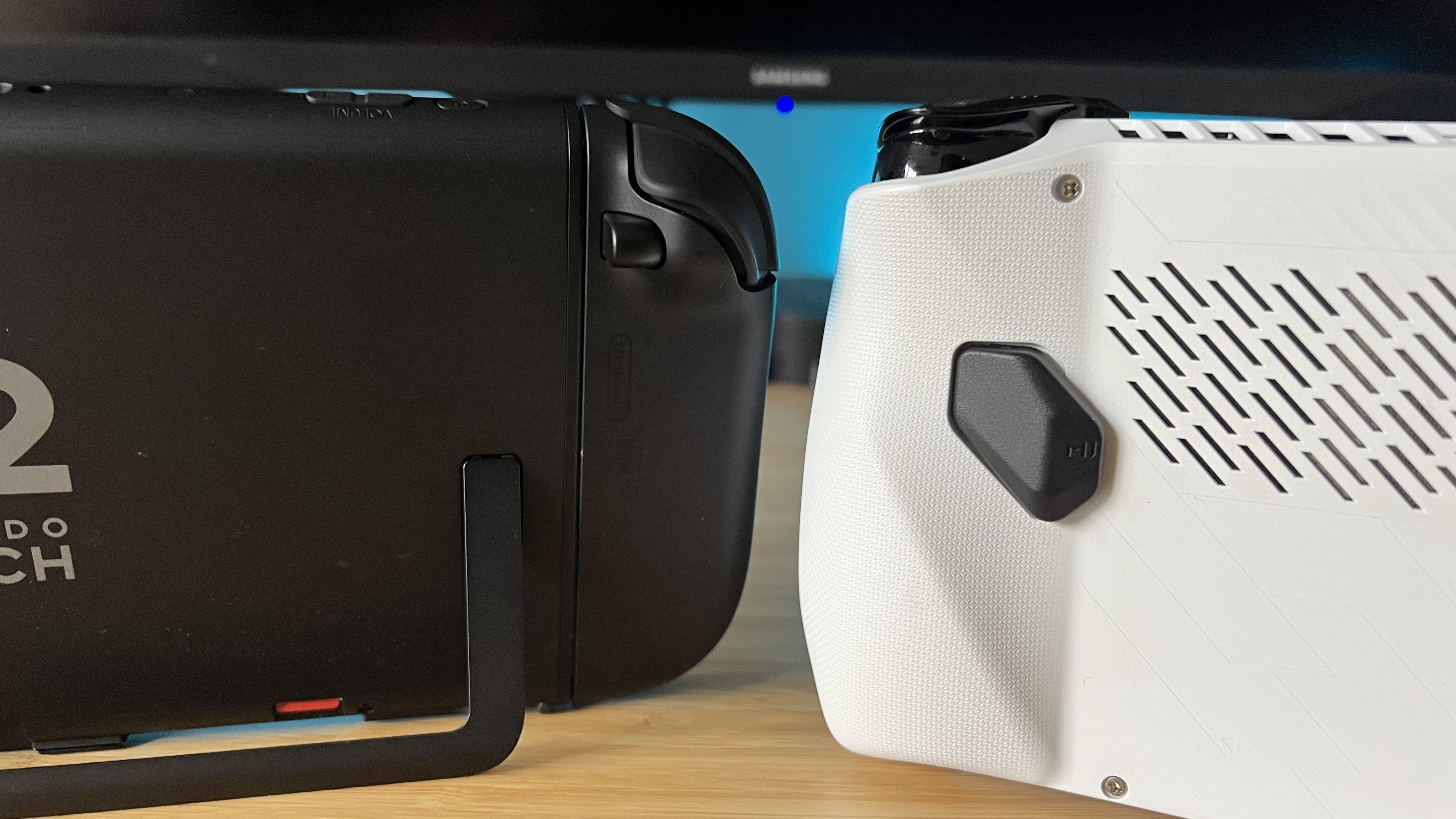 Nintendo Switch 2 and Asus ROG Ally from the back, showing differences in grip design