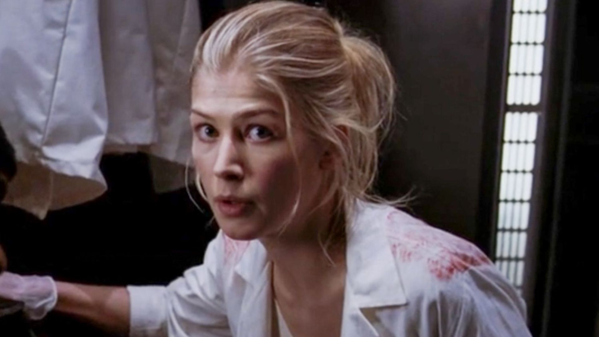 Rosamund Pike as a bloodied Dr. Grimm in Doom