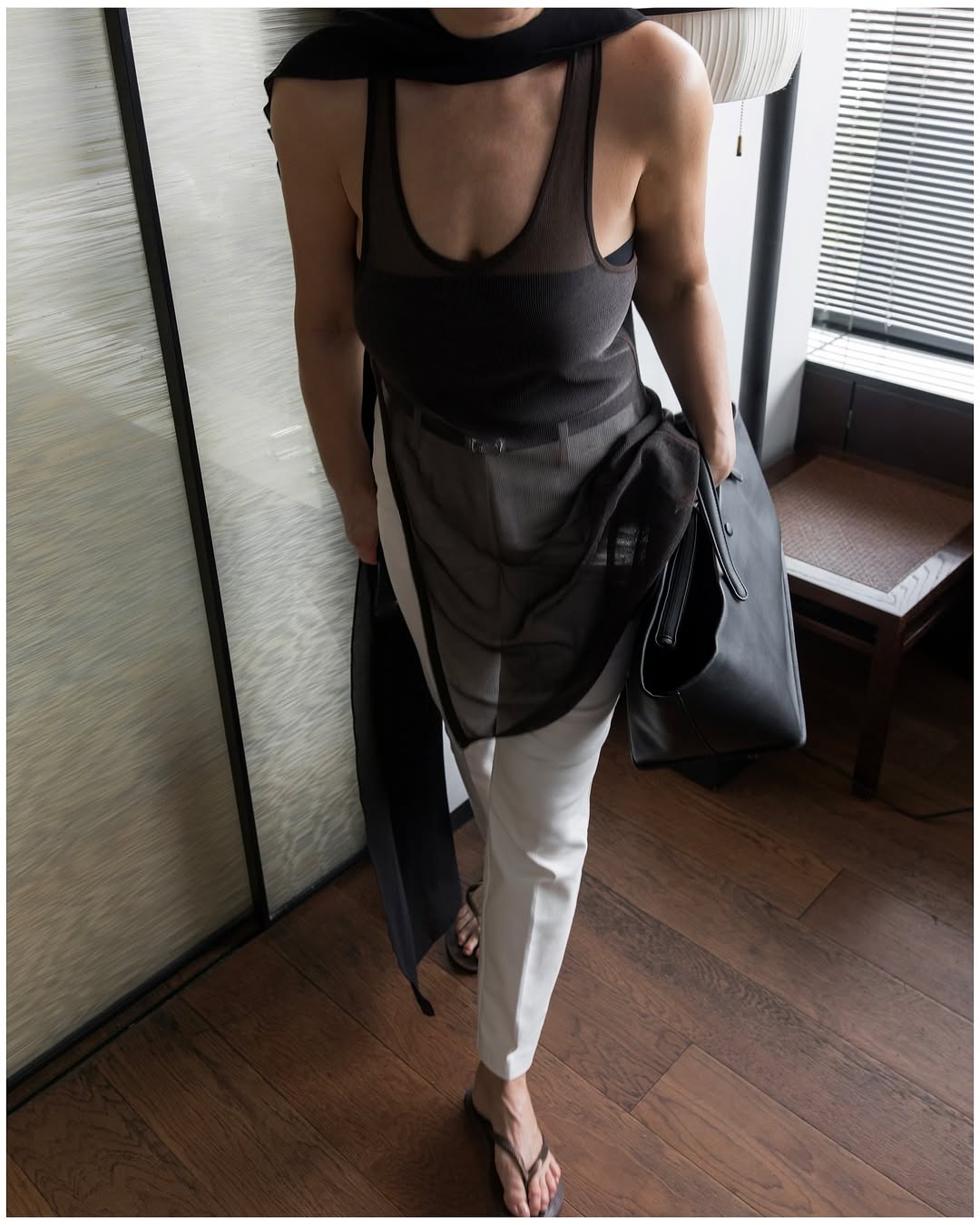 woman wearing dress over pants fall outfit 2025