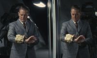 Kyle MacLachlan as Hank looking at his Pip-Boy in the Fallout show