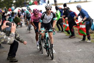 Spectators cheer as Team BikeExchange rider Great Britains Simon Yates Front and overall leader Team Ineos rider Colombias Egan Bernal ride in the last ascent during the 14th stage of the Giro dItalia 2021 cycling race 205km between Citadella and Monte Zoncolan on May 22 2021 Photo by Tim De WAELE POOL AFP Photo by TIM DE WAELEPOOLAFP via Getty Images