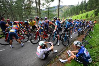 Itzulia Basque Country stage 4: riders in the neutralised peloton waiting for the race to restart after the crash