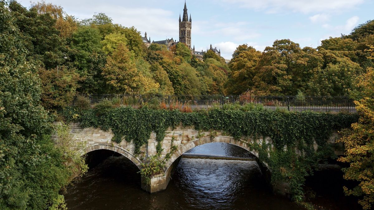 University of Glasgow behind lush trees, Glasgow, Scotland