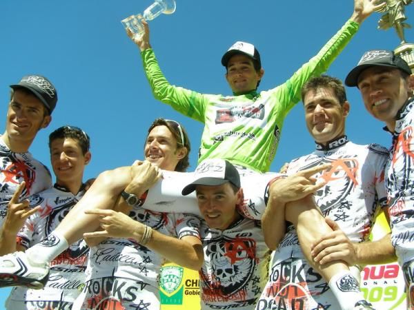 The Rock Racing team hoists overall winner Oscar Sevilla aloft.