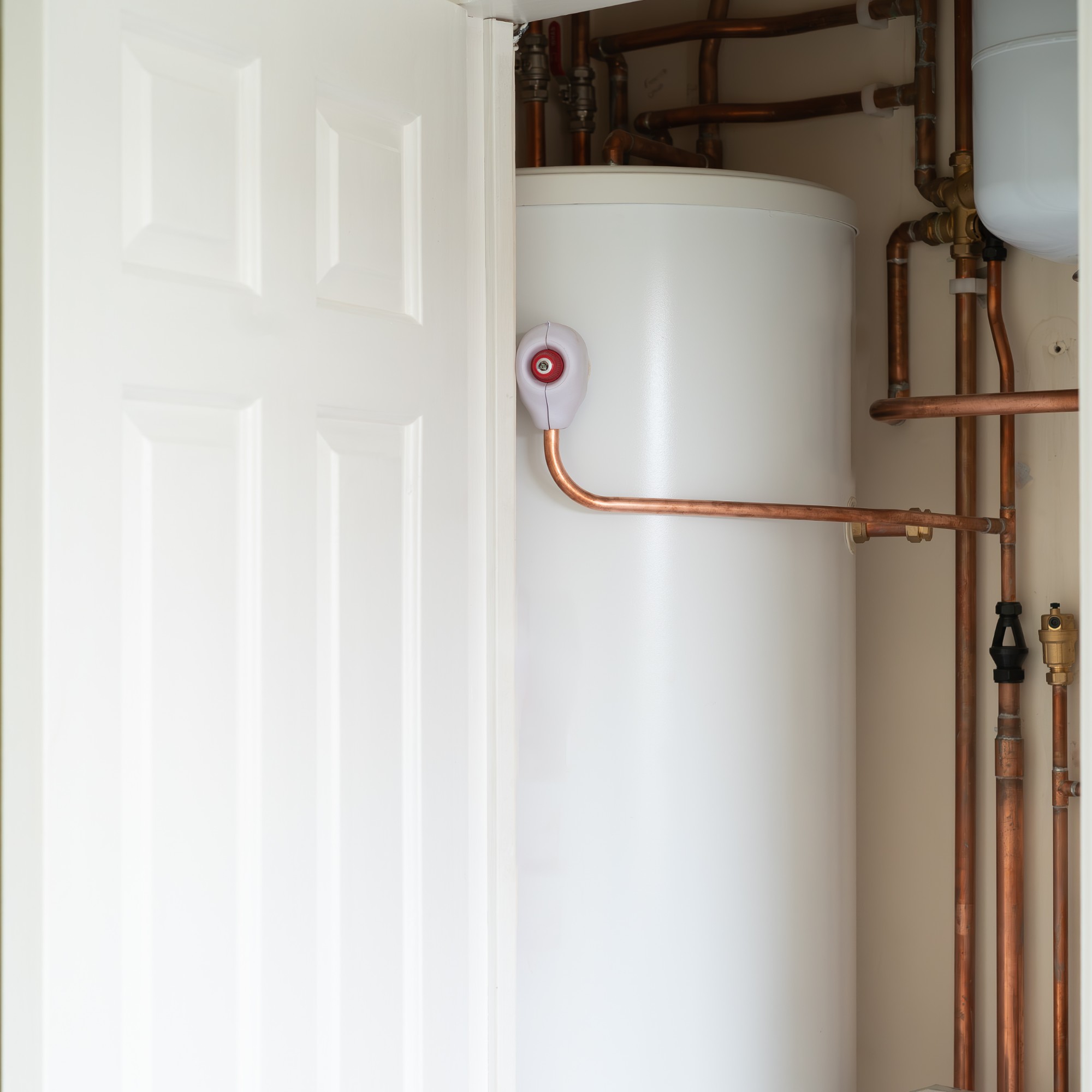 Water tank and pipe works in an airing cupboard