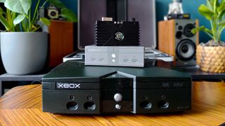 Eon XBHD sitting with box on top of original Xbox console