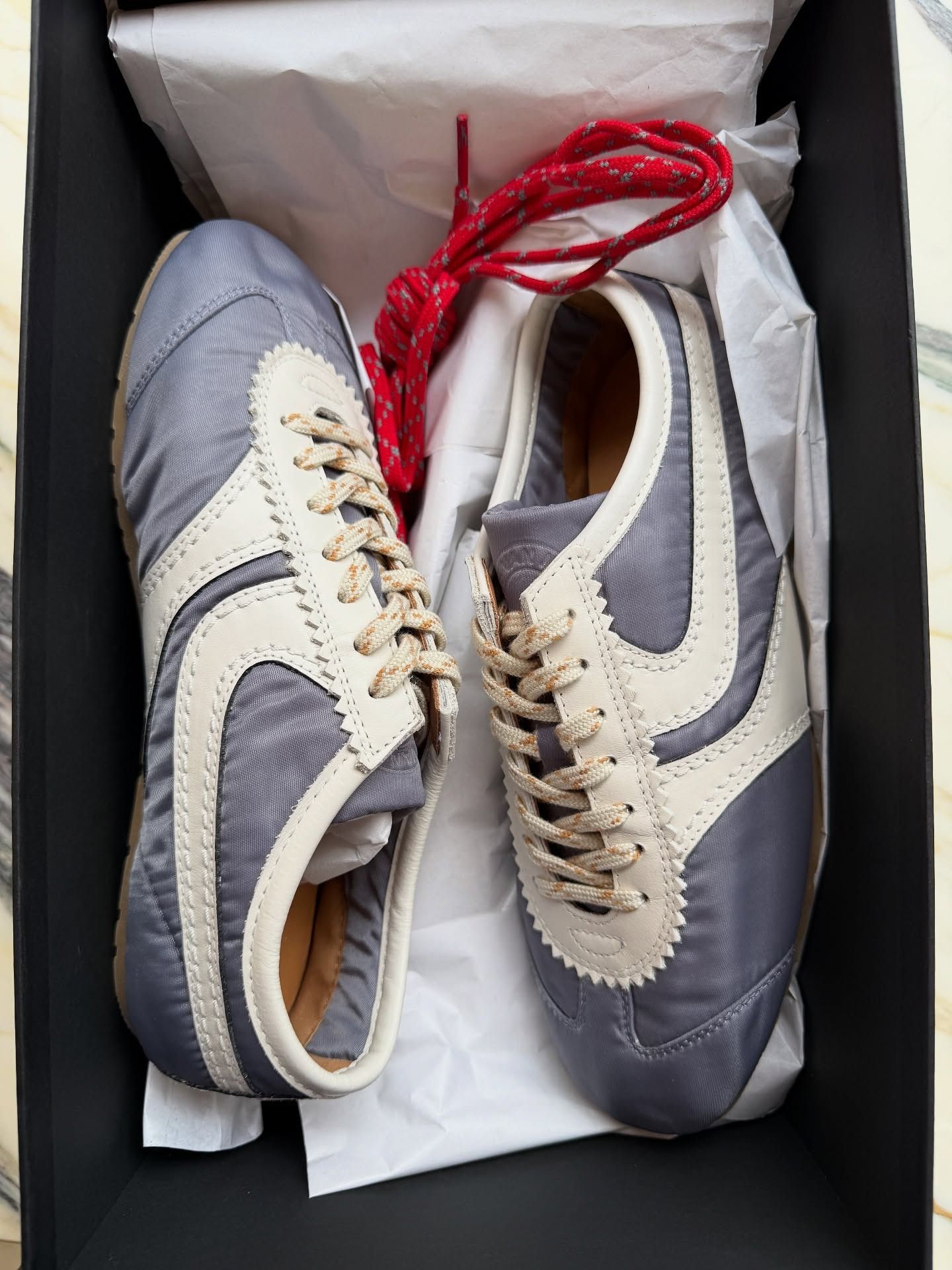 Fashion person Marianne Smyth shoes London winter shoe trends 2025. She shoes the Dries Van Noten trainers