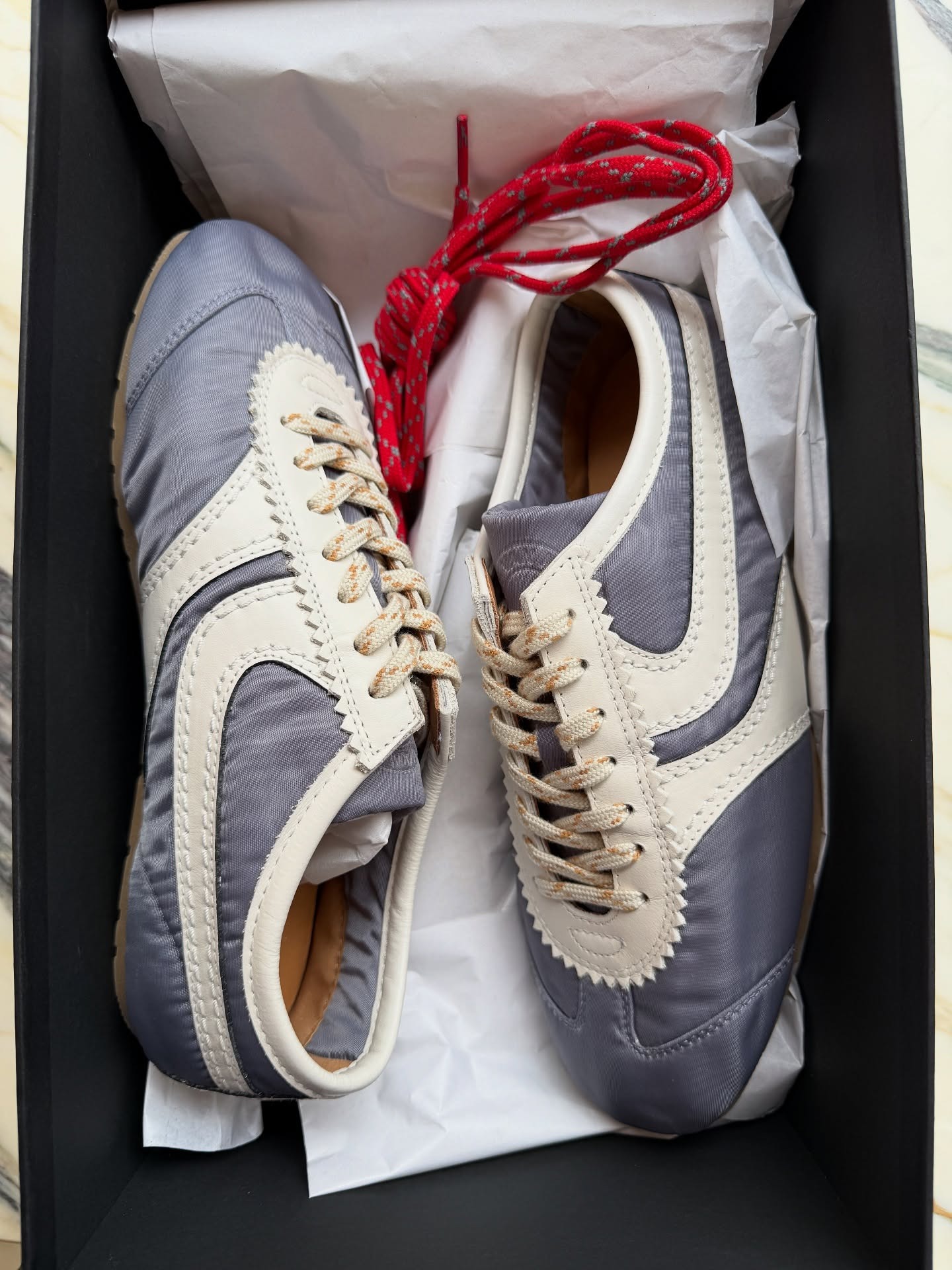 Fashion person Marianne Smyth shoes London winter shoe trends 2025. She shoes the Dries Van Noten trainers