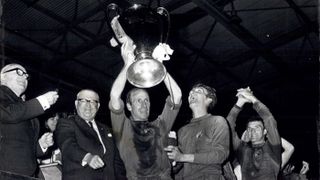 Manchester United captain Bobby Charlton lifts the European Cup at Wembley in 1968