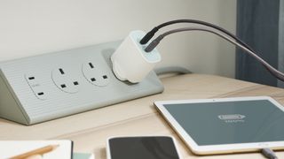 The IKEA Sjoss charger in a plug on a table