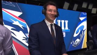 Tony Romo broadcasts the Patriots and Rams game for CBS.