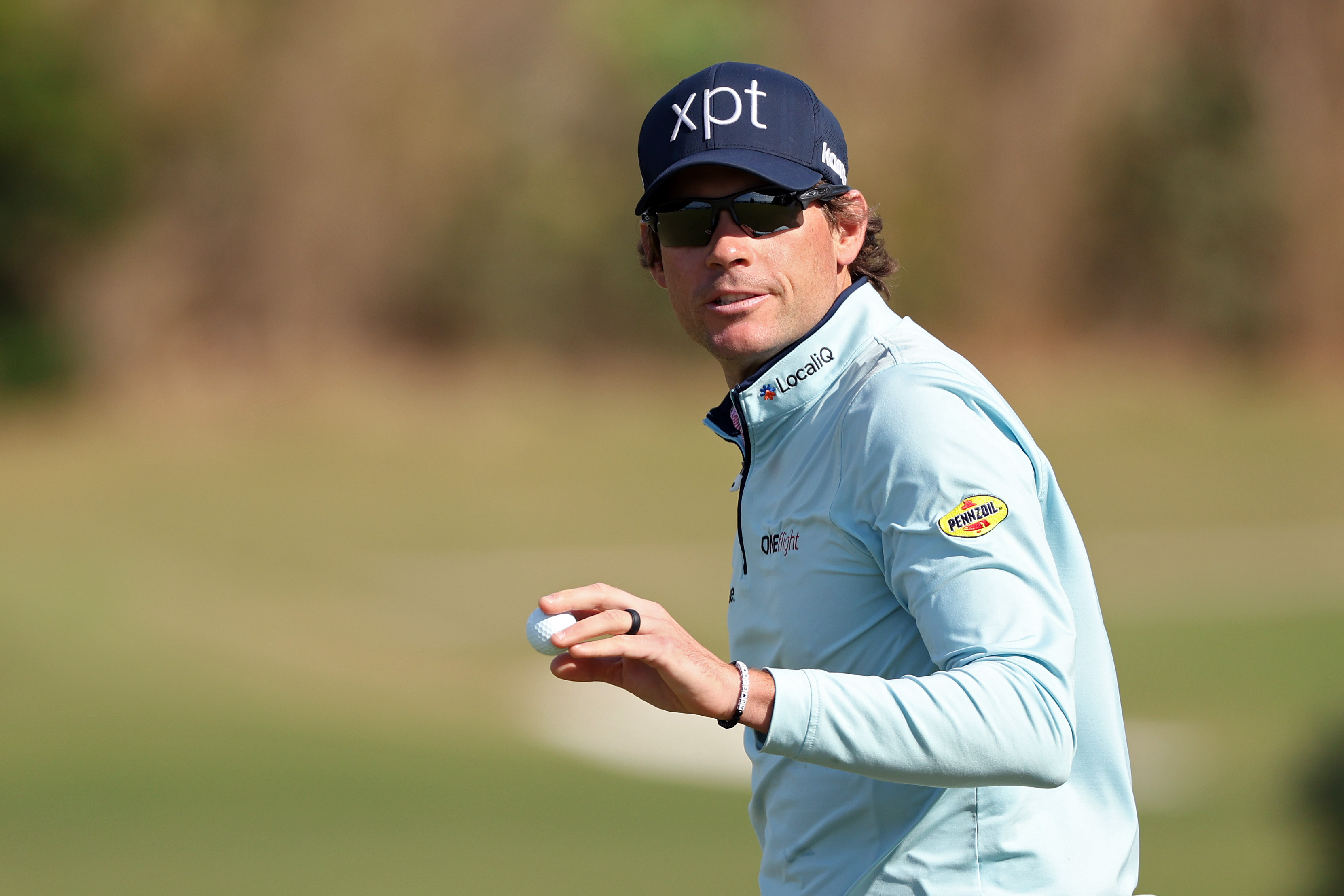 Adam Schenk waves to the crowd