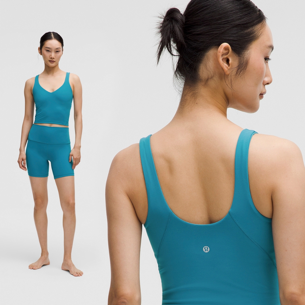 Model wearing a short and tank top set in teal from lululemon