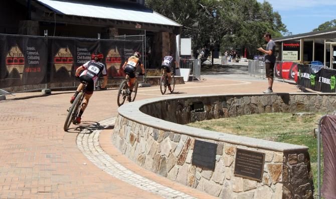 Bec Henderson leading Jenni King and Tory Thomas out of the Mt Buller event village in the elite women's cross country