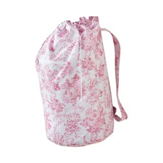 A pink and white floral colored laundry backpack