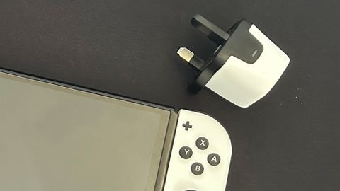 Genki Covert Dock Mini with Nintendo Switch on a matte black background