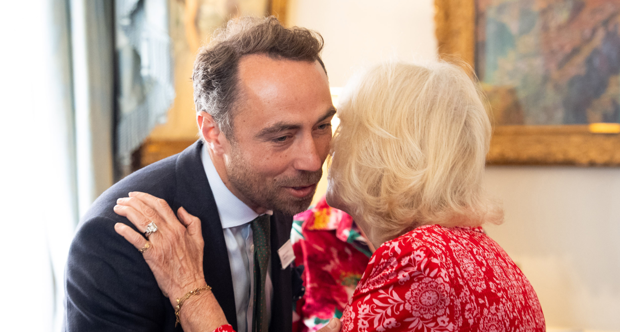 James Middleton hugging Queen Camilla