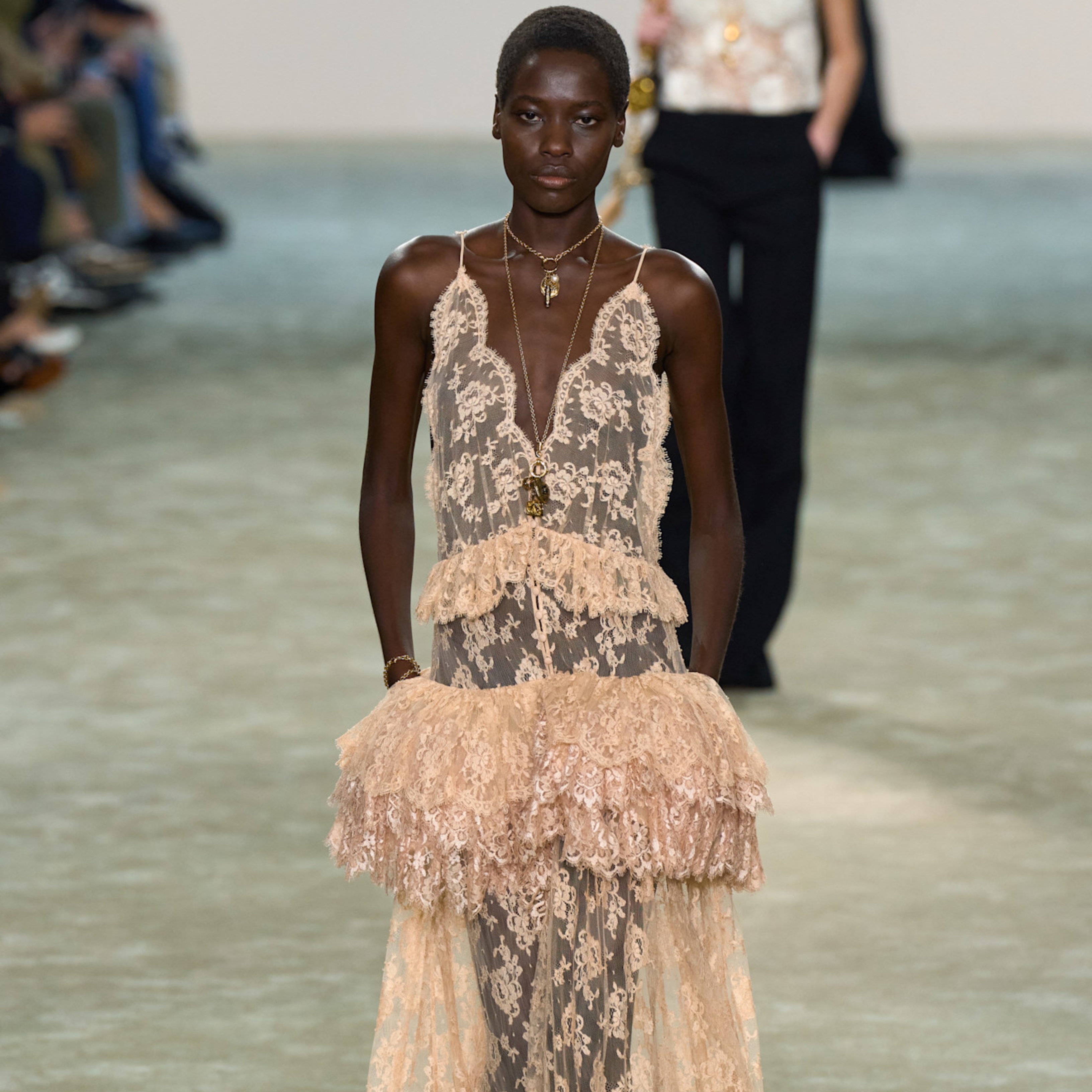 model wearing a lace dress on chloe's fall 2025 runway 